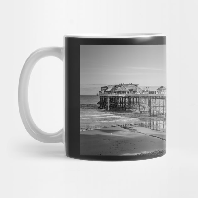 Side on view of Cromer pier on the North Norfolk coast by yackers1